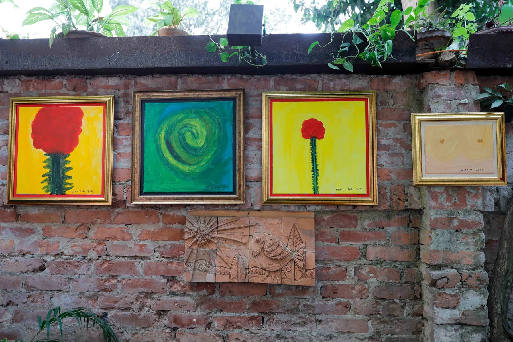 Small square paintings hung on brick — Imagination, a presentation of work by Jamil Khan at Gallery Cosmos