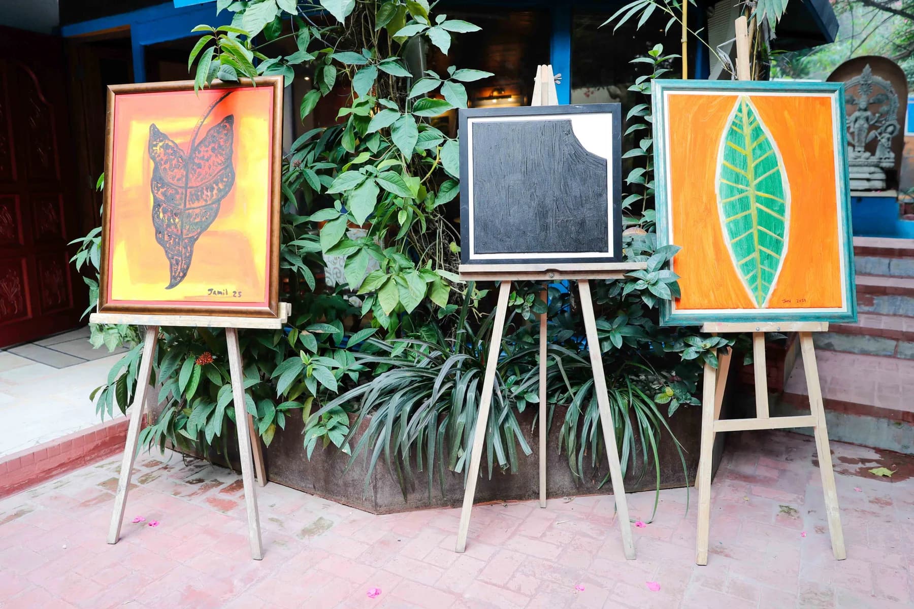 Paintings on easels among the planting — Imagination, a presentation of work by Jamil Khan at Gallery Cosmos