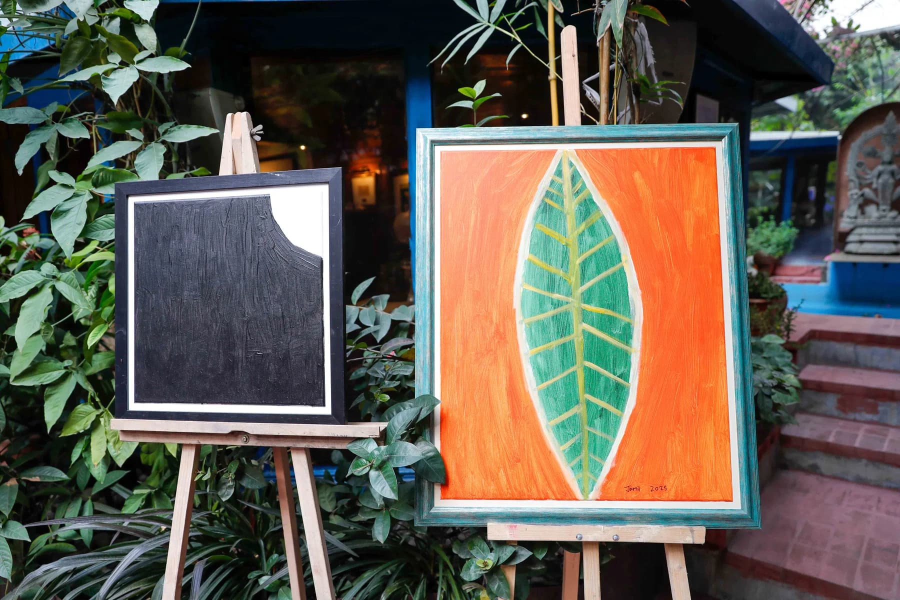 Works on easels in the courtyard — Imagination, a presentation of work by Jamil Khan at Gallery Cosmos