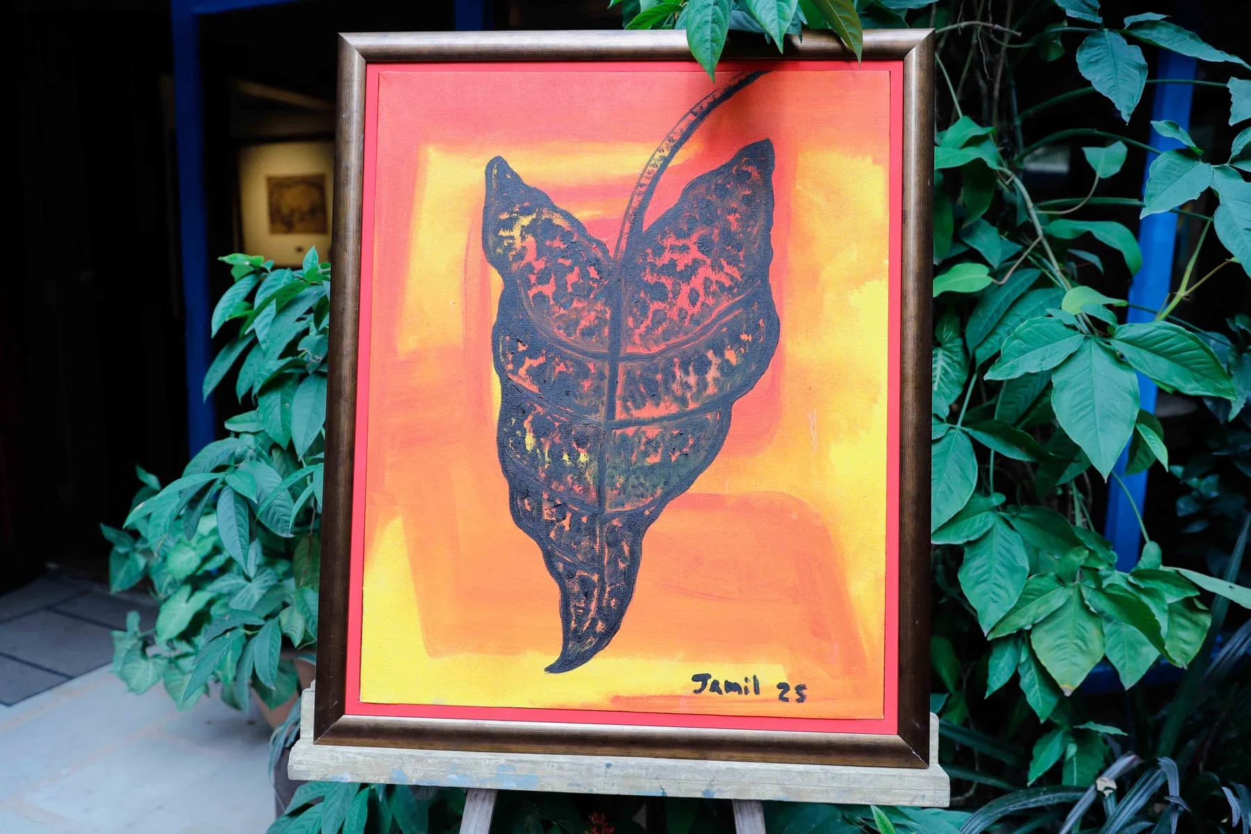 A painting on an easel in the garden — Imagination, a presentation of work by Jamil Khan at Gallery Cosmos