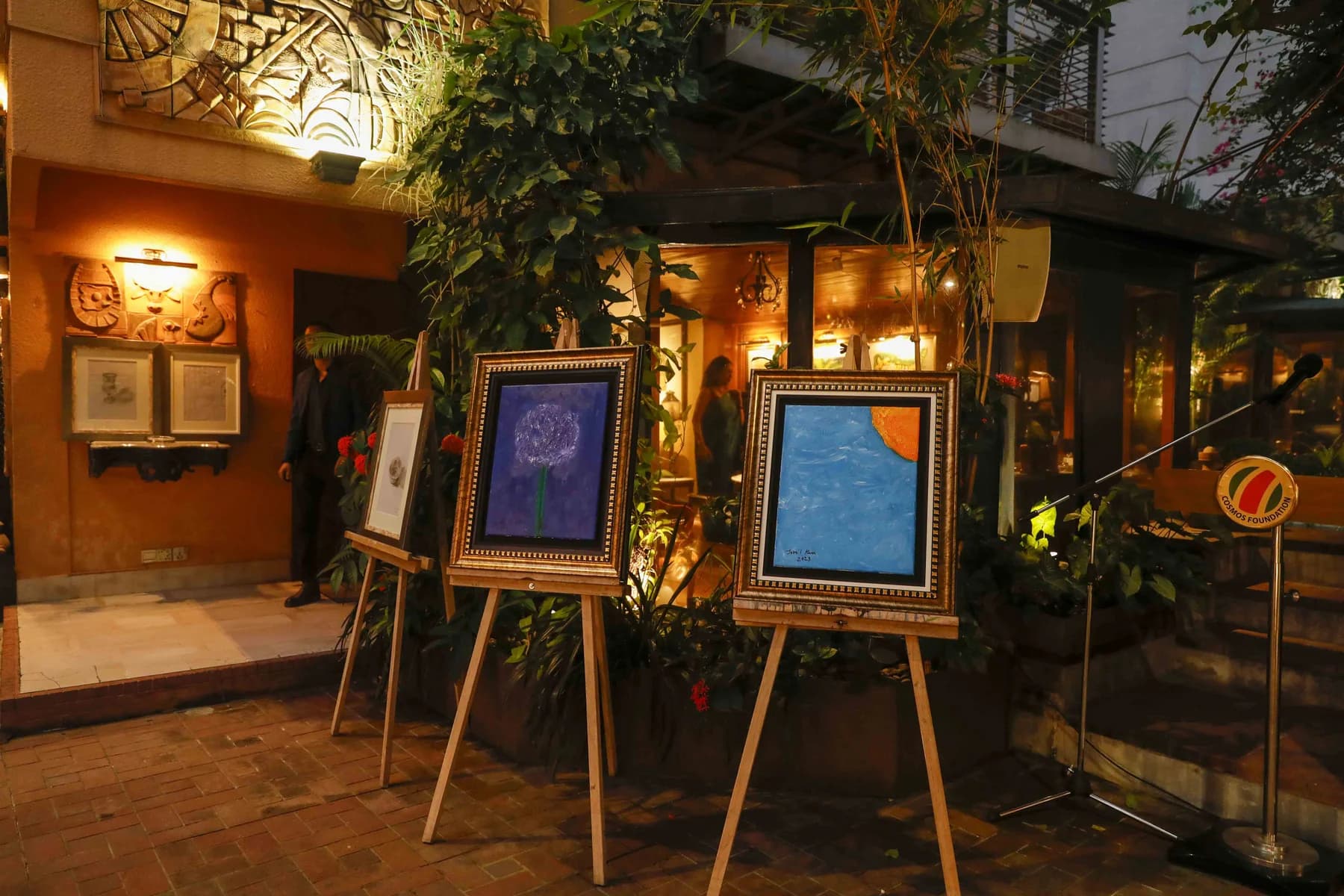 Easels set through the courtyard — Inspiration, a solo exhibition by Jamil Khan at Gallery Cosmos