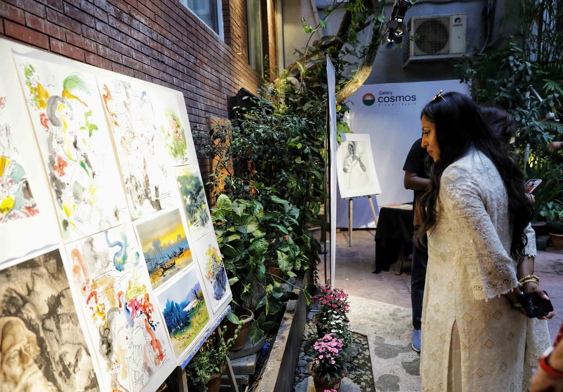 Watercolours made during the live drawing session displayed along the gallery courtyard wall