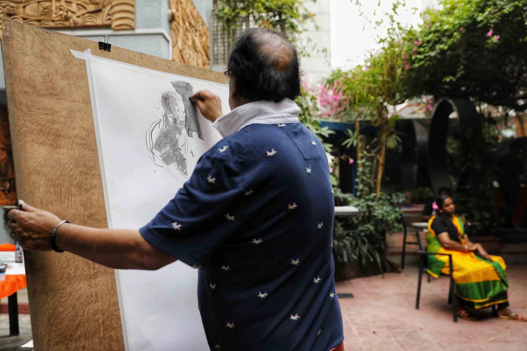 Drawing at a large sheet on the wall — the Live Drawing and Exhibition day at Gallery Cosmos